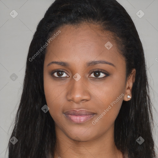 Joyful black young-adult female with long  brown hair and brown eyes