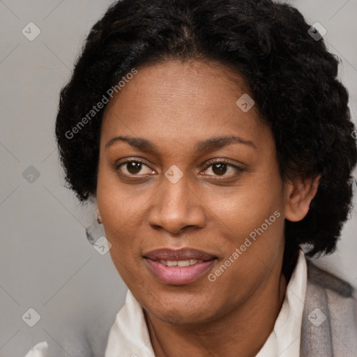 Joyful black adult female with short  brown hair and brown eyes