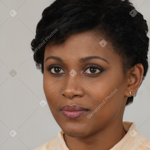 Joyful black young-adult female with short  black hair and brown eyes