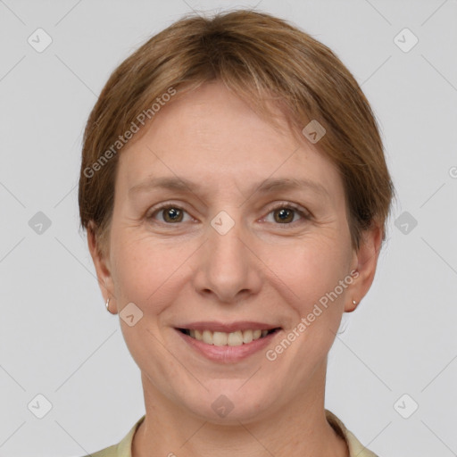 Joyful white adult female with short  brown hair and grey eyes