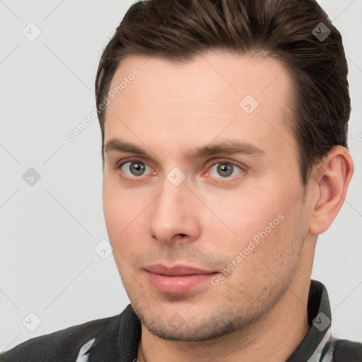 Joyful white young-adult male with short  brown hair and brown eyes