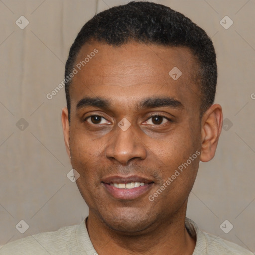 Joyful black young-adult male with short  black hair and brown eyes