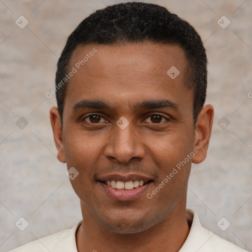 Joyful latino young-adult male with short  black hair and brown eyes