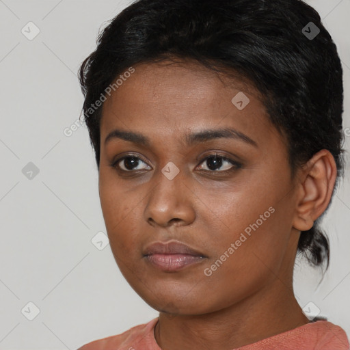 Neutral black young-adult female with short  brown hair and brown eyes