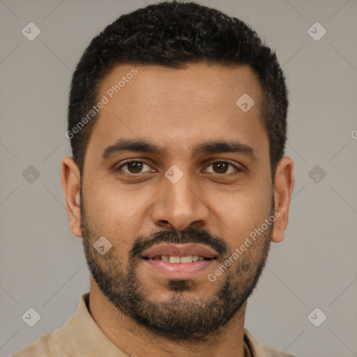 Joyful black young-adult male with short  brown hair and brown eyes