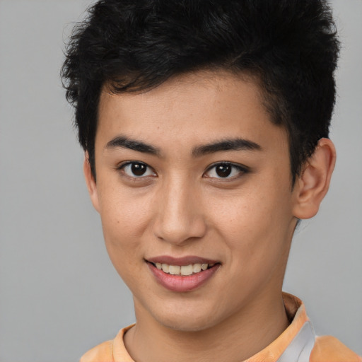 Joyful asian young-adult male with short  brown hair and brown eyes