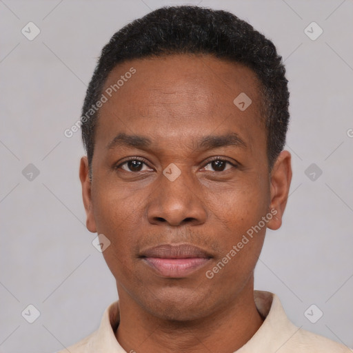 Joyful black young-adult male with short  black hair and brown eyes