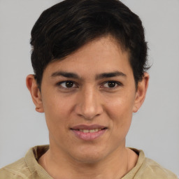 Joyful latino young-adult male with short  brown hair and brown eyes