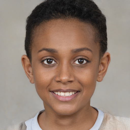 Joyful black young-adult female with short  brown hair and brown eyes