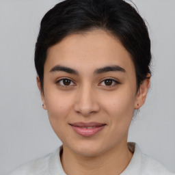 Joyful asian young-adult female with medium  brown hair and brown eyes