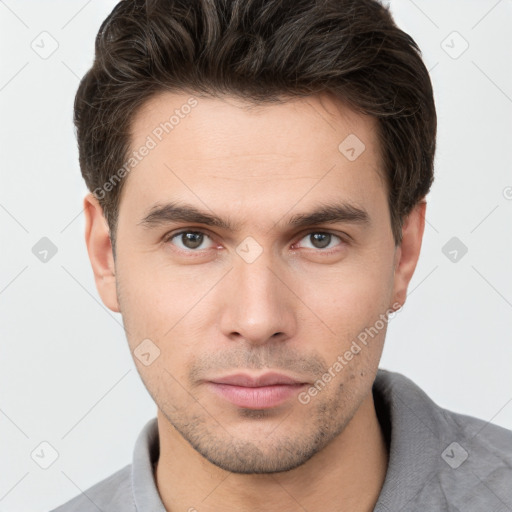 Neutral white young-adult male with short  brown hair and brown eyes