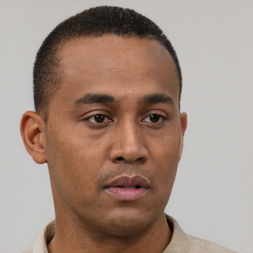 Neutral black young-adult male with short  brown hair and brown eyes