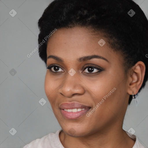 Joyful black young-adult female with short  black hair and brown eyes