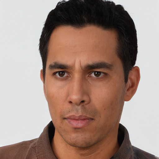 Neutral asian adult male with short  black hair and brown eyes