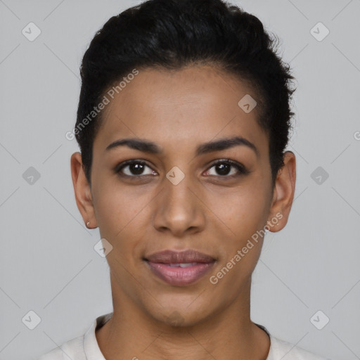 Joyful latino young-adult female with short  black hair and brown eyes