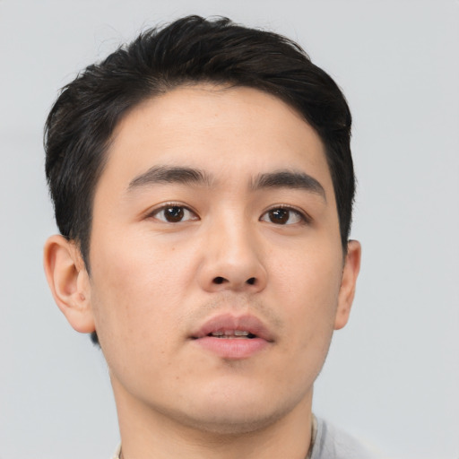 Neutral asian young-adult male with short  brown hair and brown eyes