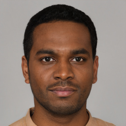 Neutral black young-adult male with short  black hair and brown eyes