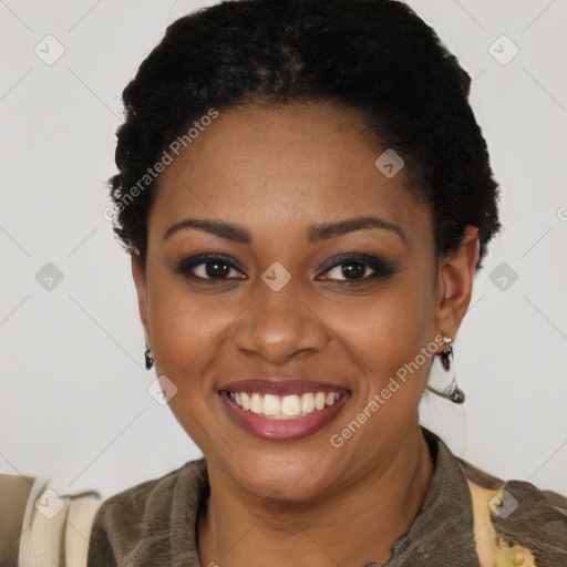 Joyful black young-adult female with short  black hair and brown eyes