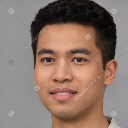 Joyful white young-adult male with short  black hair and brown eyes