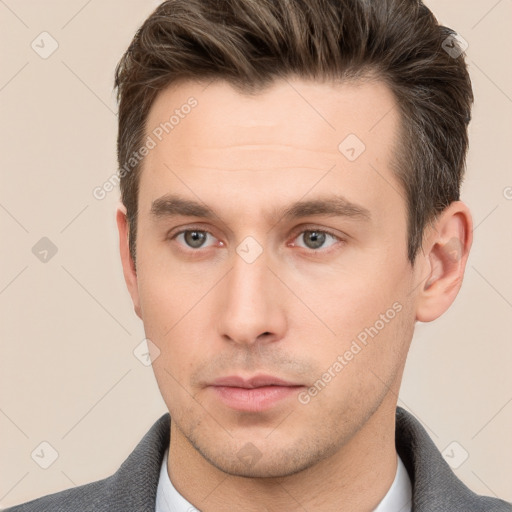 Neutral white young-adult male with short  brown hair and brown eyes