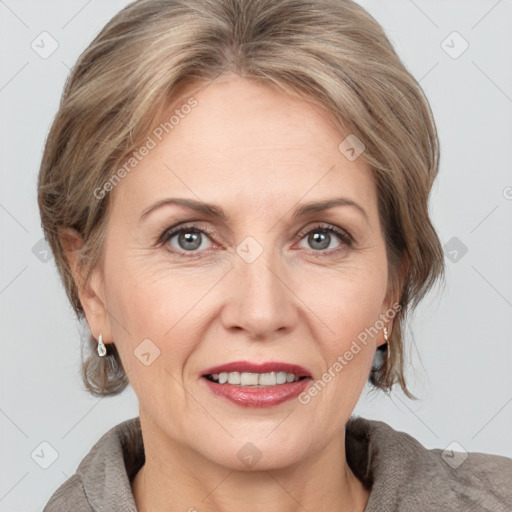 Joyful white adult female with medium  brown hair and grey eyes