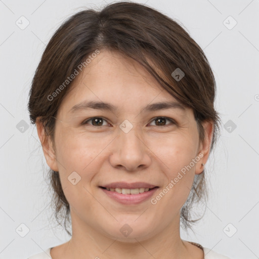 Joyful white adult female with medium  brown hair and brown eyes