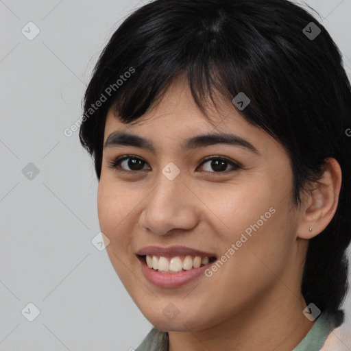 Joyful asian young-adult female with medium  brown hair and brown eyes