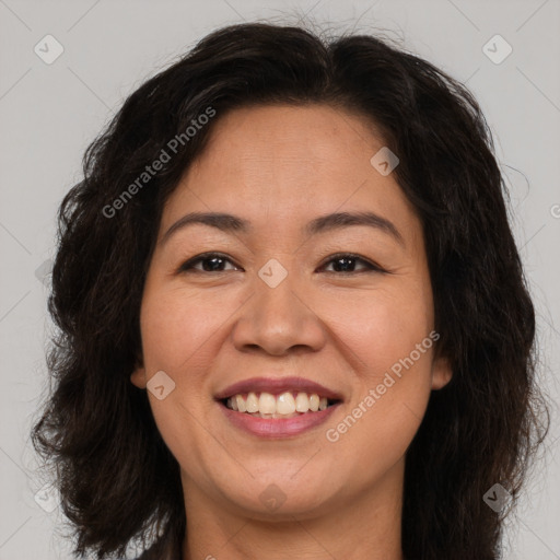 Joyful white adult female with long  brown hair and brown eyes