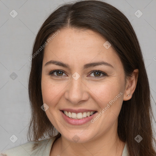 Joyful white young-adult female with long  brown hair and brown eyes