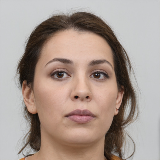 Neutral white young-adult female with medium  brown hair and brown eyes