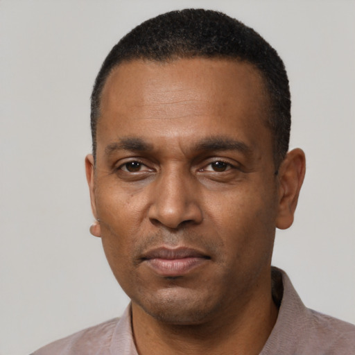 Neutral black adult male with short  black hair and brown eyes