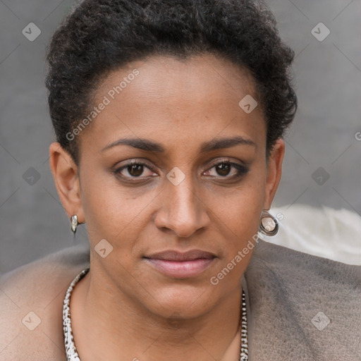 Joyful black young-adult female with short  brown hair and brown eyes