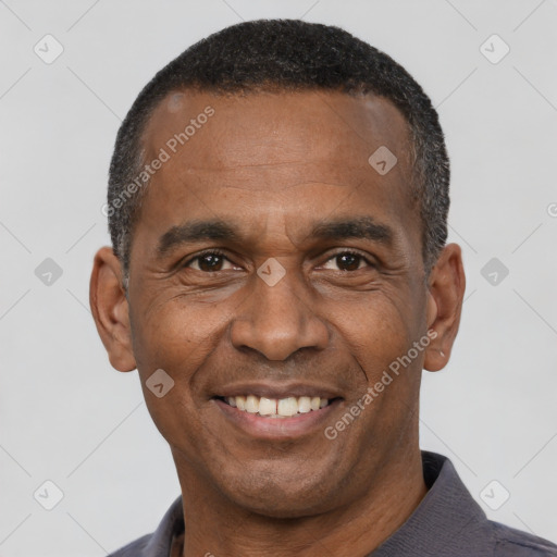 Joyful latino adult male with short  black hair and brown eyes