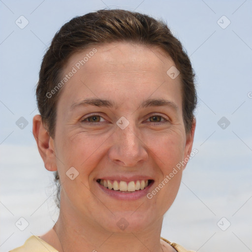 Joyful white adult female with short  brown hair and brown eyes