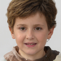 Joyful white child male with short  brown hair and brown eyes