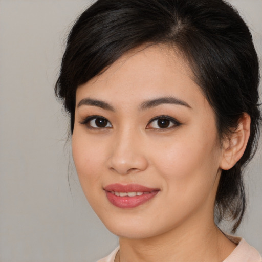 Joyful white young-adult female with medium  brown hair and brown eyes