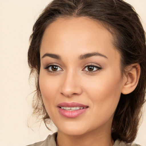 Joyful white young-adult female with medium  brown hair and brown eyes