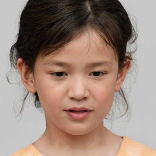 Joyful white child female with medium  brown hair and brown eyes