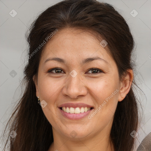 Joyful white adult female with long  brown hair and brown eyes