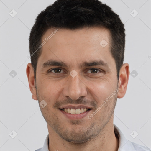 Joyful white young-adult male with short  brown hair and brown eyes