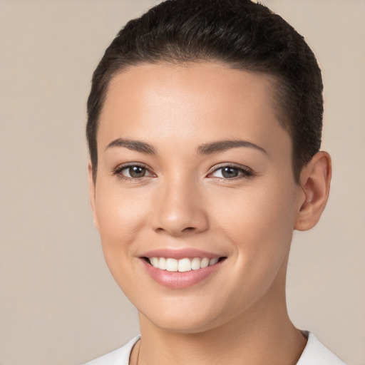 Joyful white young-adult female with short  brown hair and brown eyes