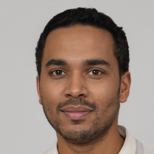 Neutral latino young-adult male with short  black hair and brown eyes
