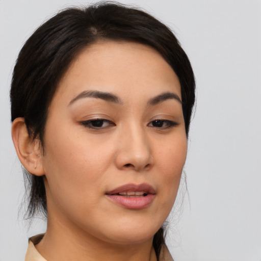 Joyful asian young-adult female with medium  brown hair and brown eyes