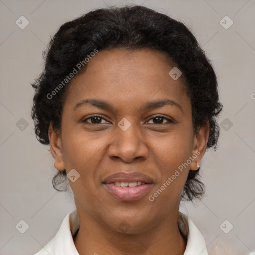 Joyful black adult female with short  brown hair and brown eyes