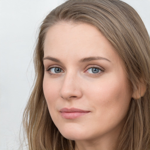 Neutral white young-adult female with long  brown hair and grey eyes