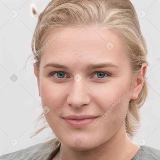 Joyful white young-adult female with medium  brown hair and blue eyes