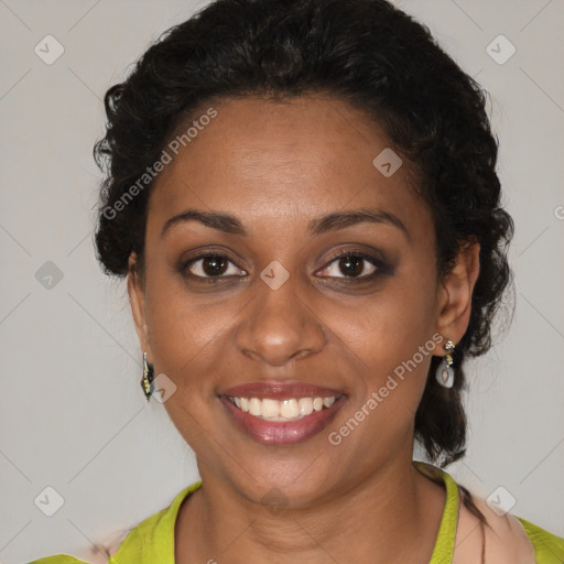 Joyful black young-adult female with short  brown hair and brown eyes