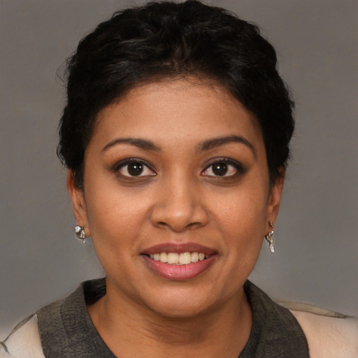 Joyful white young-adult female with short  black hair and brown eyes