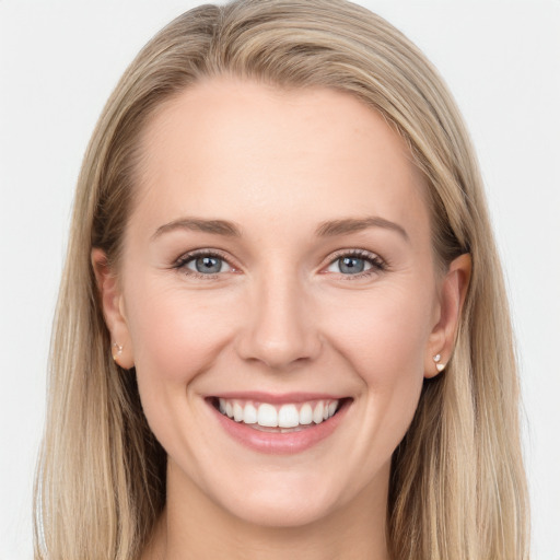 Joyful white young-adult female with long  brown hair and grey eyes