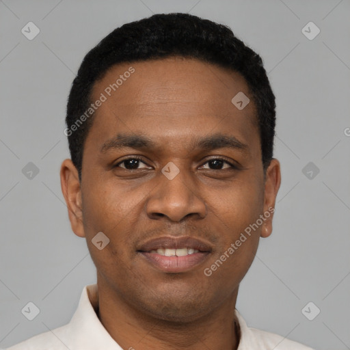 Joyful black young-adult male with short  black hair and brown eyes